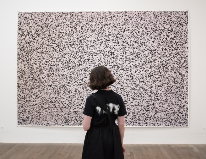 Someone from the Tate Looking at a Photograph of Static